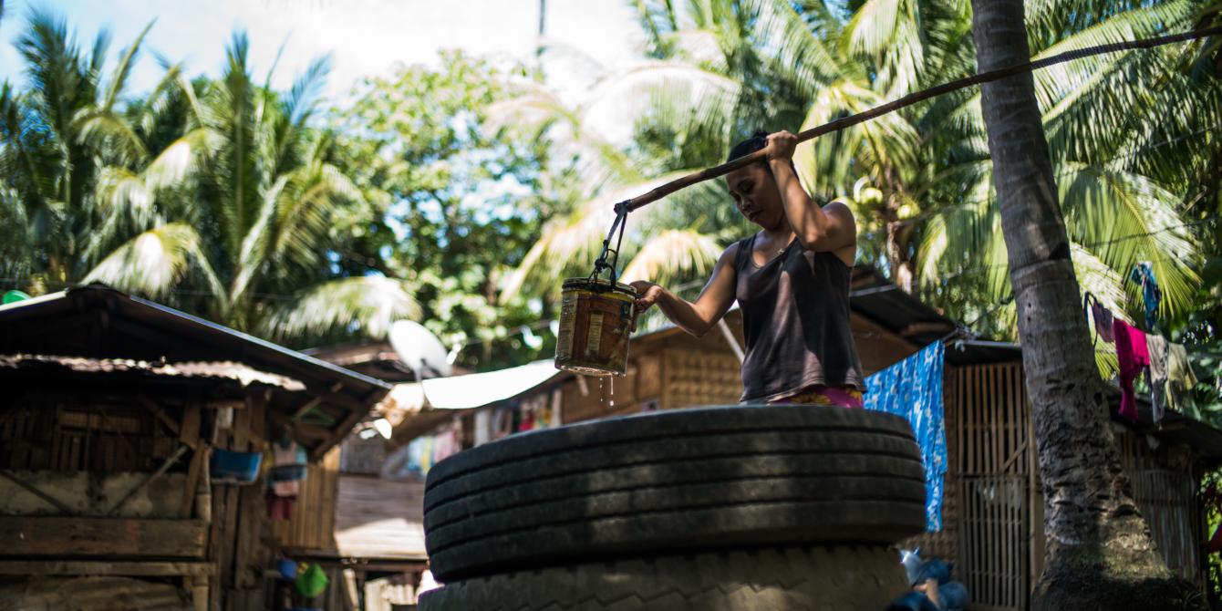 A resident of Gumaga in Libungan, Cotabato, fetches water from a deep well, which used to be their main source of water for years. Through SIMCARRD and Oxfam—and with counterpart funding from the barangay local government—almost 60 families in the area now have access to clean and safe water from a newly installed water point. (Photo: Jed Regala/Oxfam) A resident of Gumaga in Libungan, Cotabato, fetches water from a deep well, which used to be their main source of water for years. Through SIMCARRD and Oxfam—and with counterpart funding from the barangay local government—almost 60 families in the area now have access to clean and safe water from a newly installed water point. (Photo: Jed Regala/Oxfam)